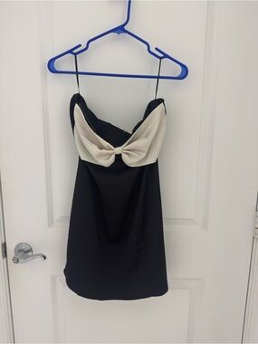 Princess Polly black mini dress with white bow